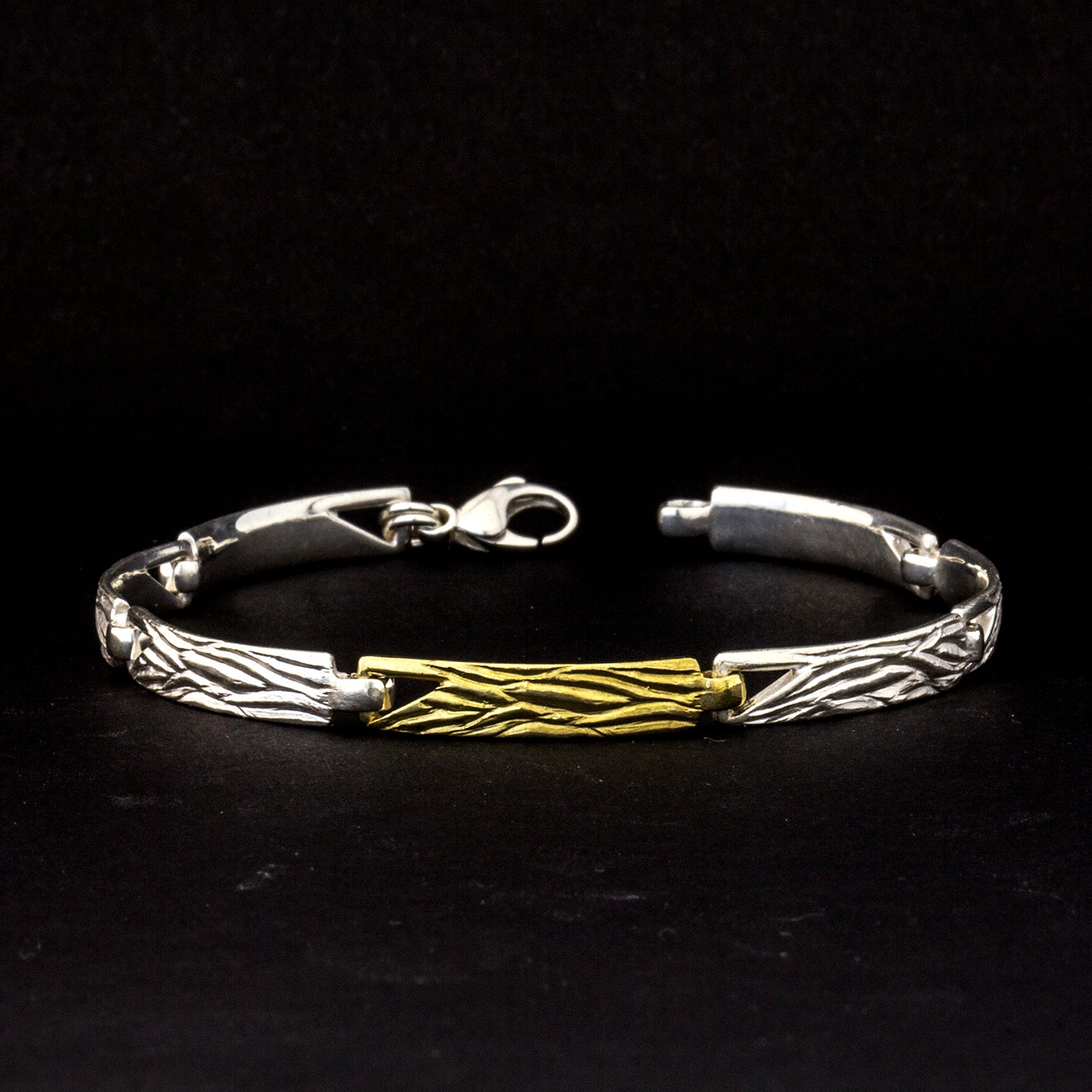 Armband 'Wellen' aus Sterling Silber mit einem Gelbgoldteil